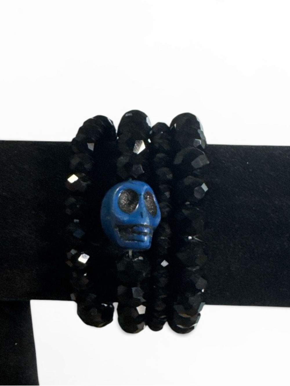 Black Beaded Stretch Bracelet with Blue Skull Accent - Picture 1 of 3